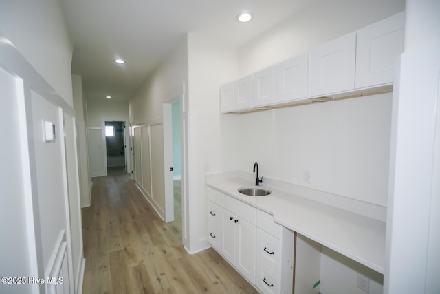 5228 E Beach Dr, Oak Island, NC 28465 - interior space with recessed lighting, light wood-style floors, and a sink