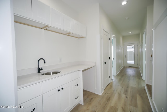 5228 E Beach Dr, Oak Island, NC 28465 - interior space with a sink, light wood-style floors, and recessed lighting