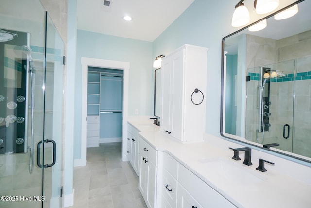 5228 E Beach Dr, Oak Island, NC 28465 - full bathroom with double vanity, a sink, a stall shower, and tile patterned flooring