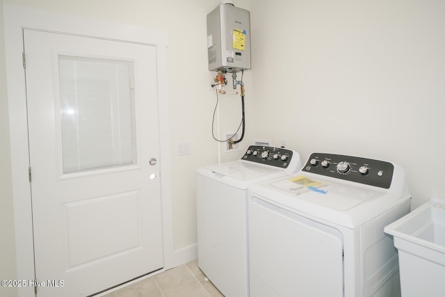 5228 E Beach Dr, Oak Island, NC 28465 - washroom with separate washer and dryer, a sink, tankless water heater, and laundry area