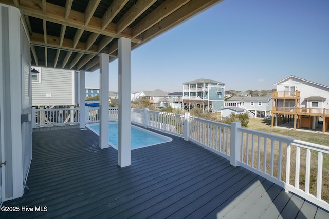 5228 E Beach Dr, Oak Island, NC 28465 - deck with a residential view and a fenced in pool