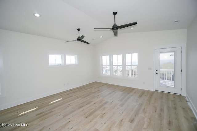 5228 E Beach Dr, Oak Island, NC 28465 - interior space with baseboards, light wood-style floors, lofted ceiling, and recessed lighting