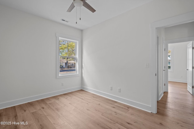 empty room featuring light hardwood / wood-style flooring and ceiling fan