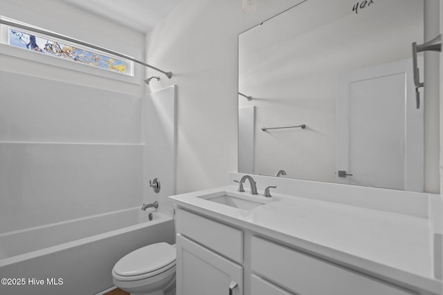 full bathroom featuring shower / washtub combination, toilet, and vanity