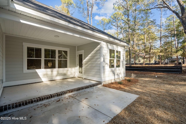 property entrance with a patio