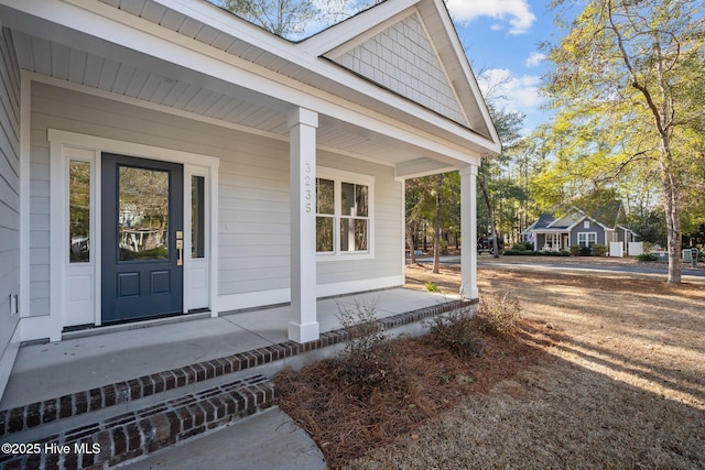 property entrance featuring covered porch