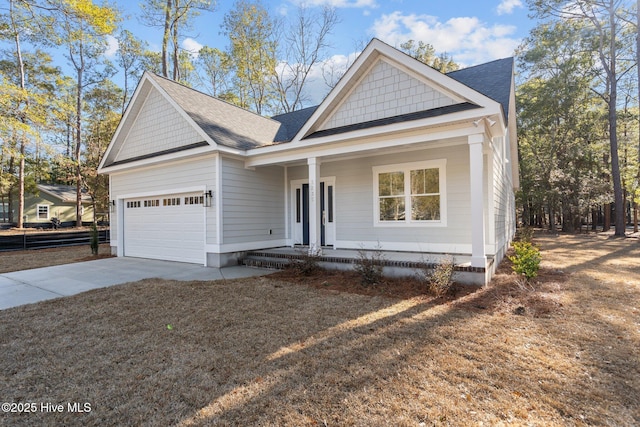 view of front of property with a garage and a porch