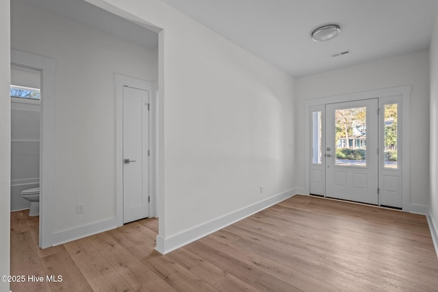 foyer entrance with light hardwood / wood-style flooring