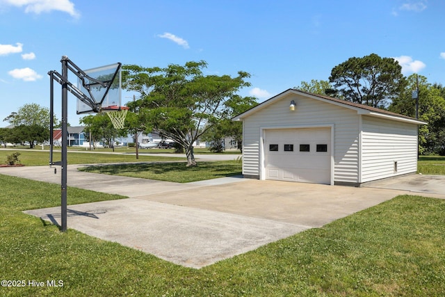 detached garage featuring concrete driveway