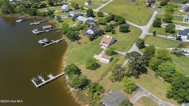 aerial view of property's location with a large body of water