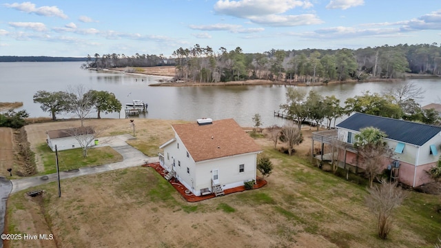 birds eye view of property with a water view