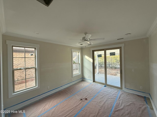 unfurnished room with ornamental molding and ceiling fan