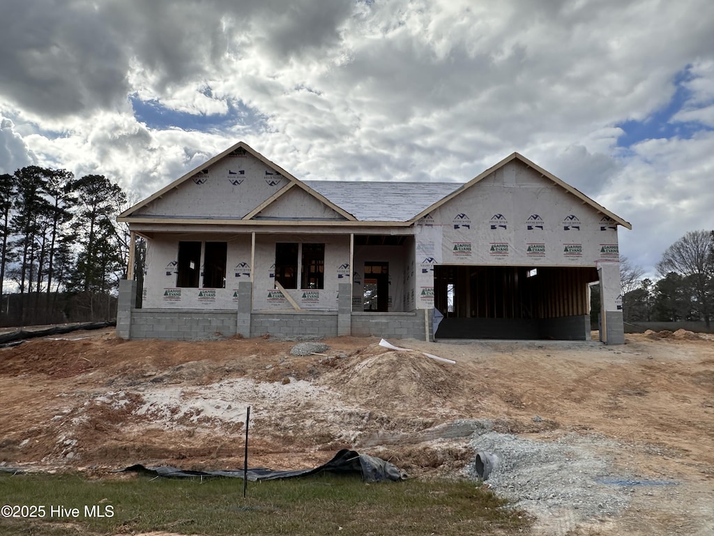 property in mid-construction featuring a porch