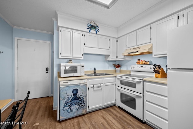 kitchen featuring sink, ornamental molding, hardwood / wood-style flooring, white appliances, and white cabinets