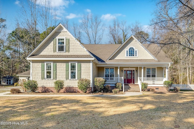 view of front facade featuring covered porch and a front lawn