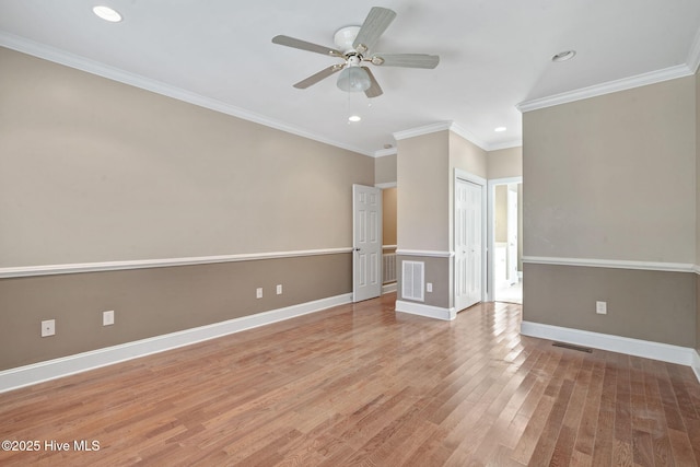 unfurnished room with crown molding, ceiling fan, and wood-type flooring