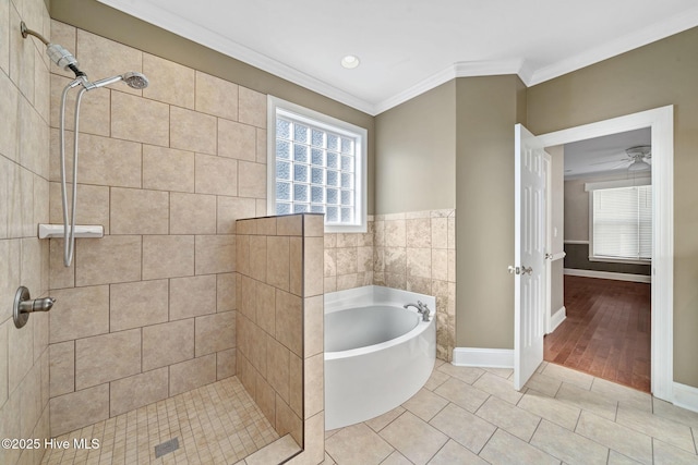 bathroom with crown molding, shower with separate bathtub, and tile patterned flooring