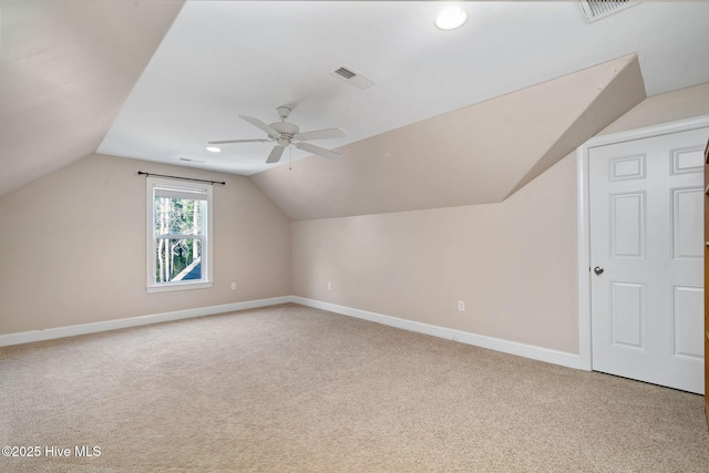 bonus room with vaulted ceiling, ceiling fan, and carpet