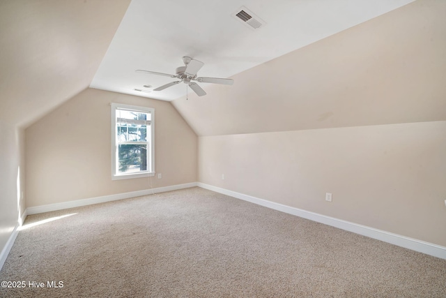 bonus room with vaulted ceiling, ceiling fan, and carpet flooring