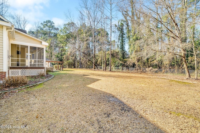 view of yard featuring a sunroom