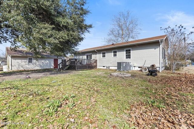 back of house with a yard, a deck, and central air condition unit