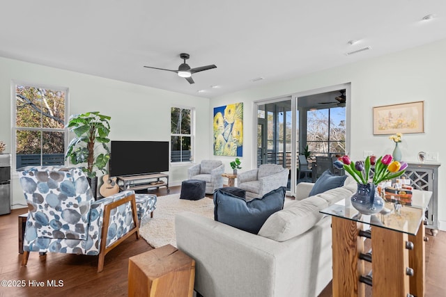 living room with ceiling fan, a healthy amount of sunlight, and hardwood / wood-style floors