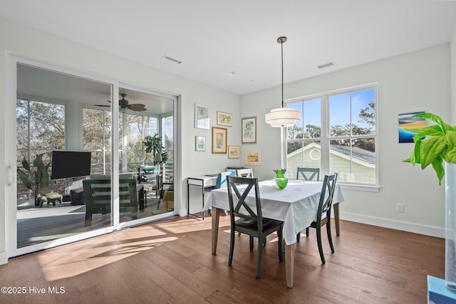 dining area with dark hardwood / wood-style floors