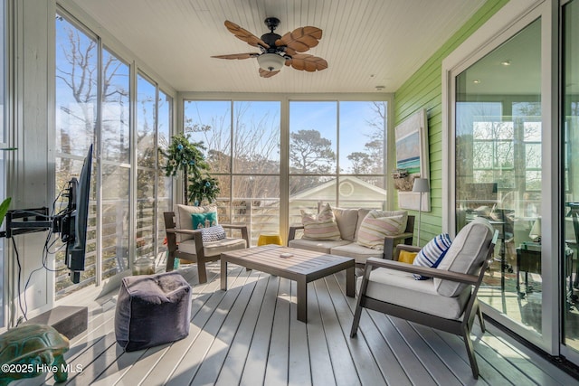 sunroom / solarium featuring wood ceiling, ceiling fan, and a wealth of natural light