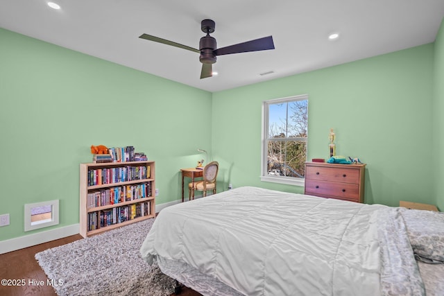 bedroom with ceiling fan and hardwood / wood-style floors