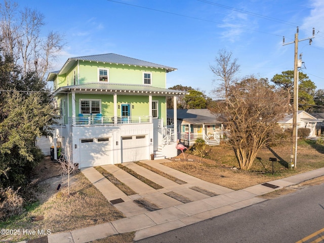 view of front of house featuring a garage and covered porch