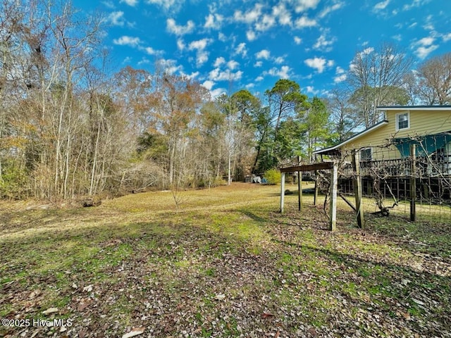 view of yard with a wooden deck