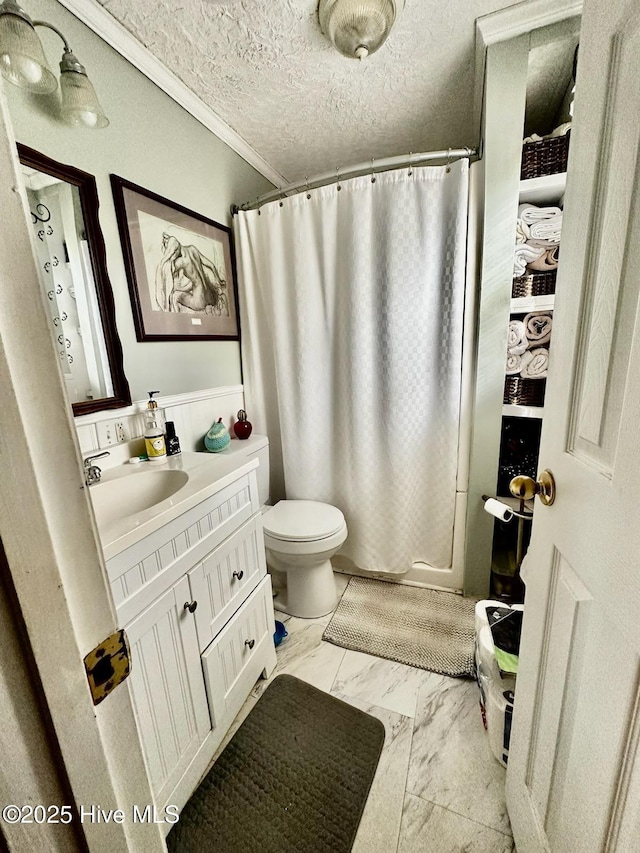 full bathroom with shower / bath combination with curtain, vanity, toilet, crown molding, and a textured ceiling