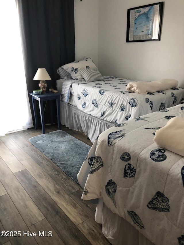 bedroom featuring wood finished floors