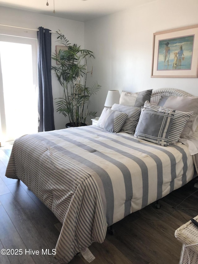 bedroom featuring wood finished floors