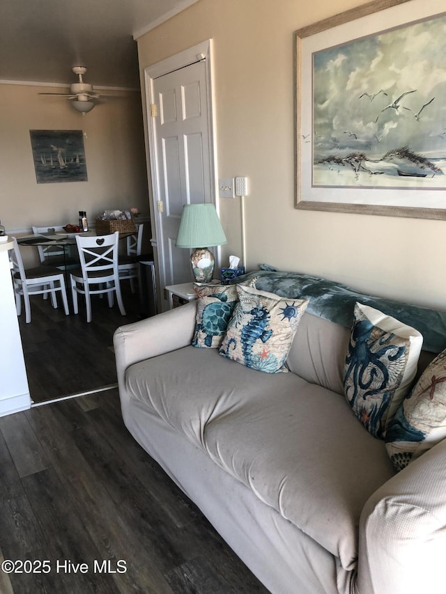 living area featuring wood finished floors and a ceiling fan