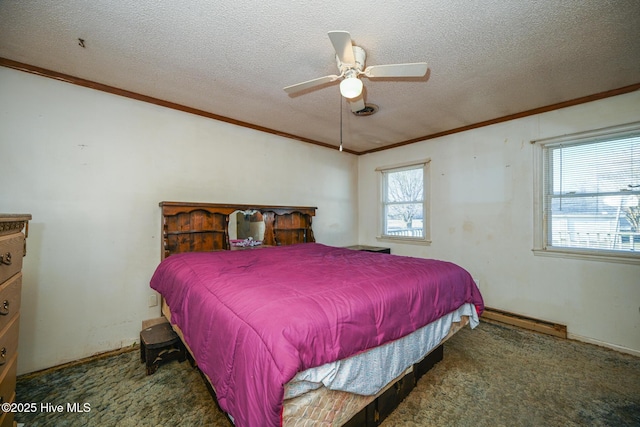 bedroom featuring crown molding, ceiling fan, baseboard heating, dark colored carpet, and a textured ceiling