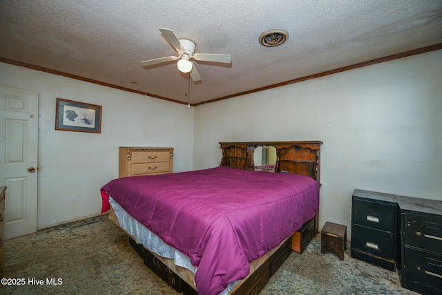 bedroom with ornamental molding, a textured ceiling, and carpet flooring