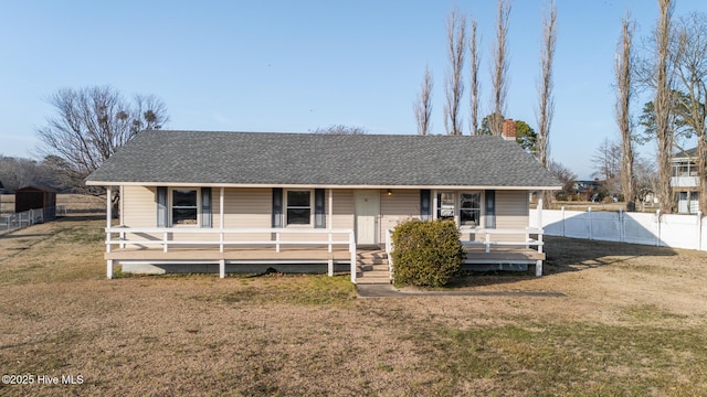 view of front facade with covered porch and a front yard