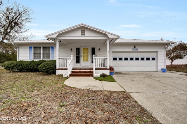 single story home featuring a porch and a garage