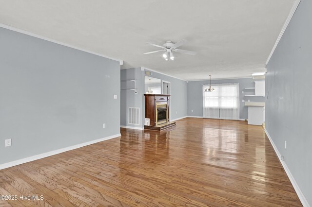 details with hardwood / wood-style flooring, a fireplace, and ornamental molding