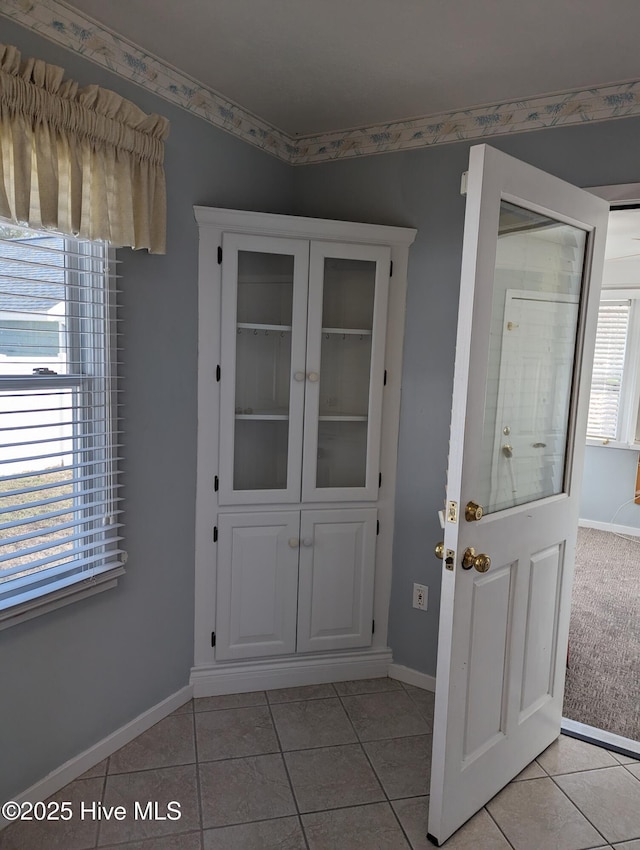 interior space featuring light tile patterned flooring