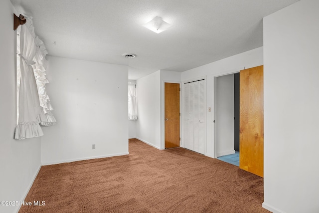 unfurnished bedroom with carpet floors