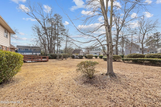 view of yard with a wooden deck