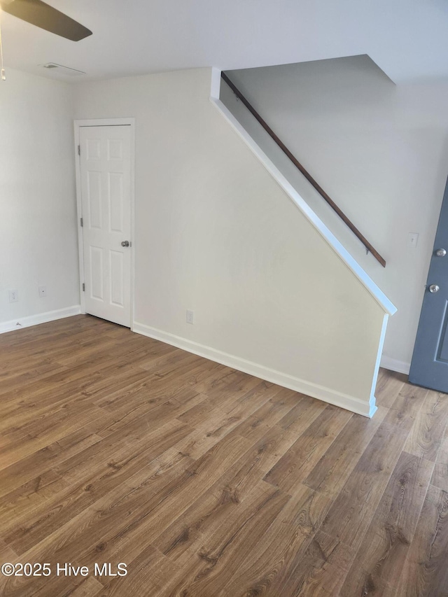 empty room featuring hardwood / wood-style floors and ceiling fan