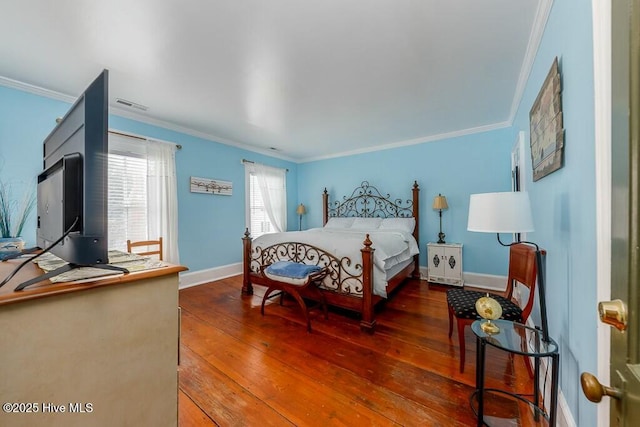 bedroom featuring crown molding and dark hardwood / wood-style flooring