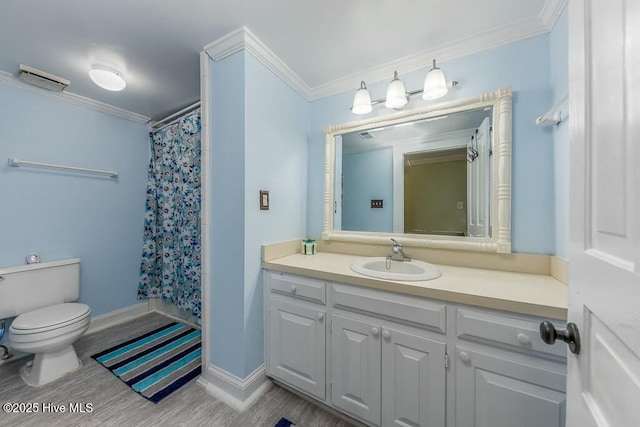 full bathroom featuring vanity, ornamental molding, shower / bath combination with curtain, and toilet