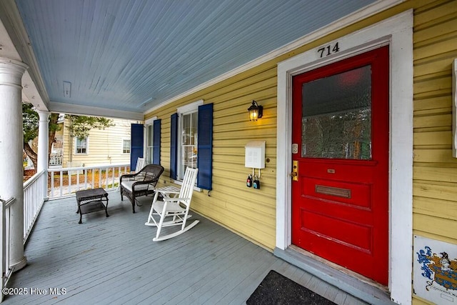 wooden terrace featuring a porch