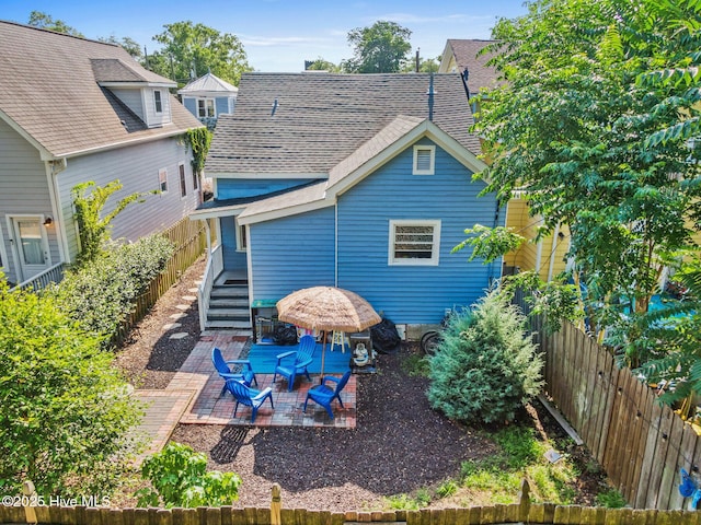 rear view of house featuring a patio