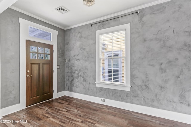 entryway with crown molding and dark hardwood / wood-style floors