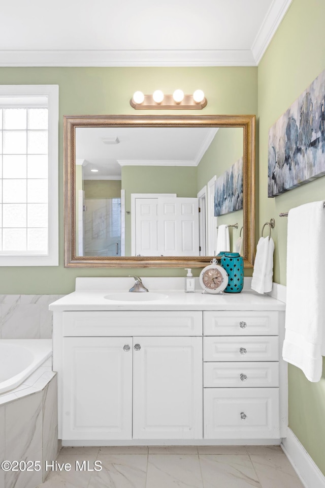 bathroom featuring crown molding, vanity, and tiled bath